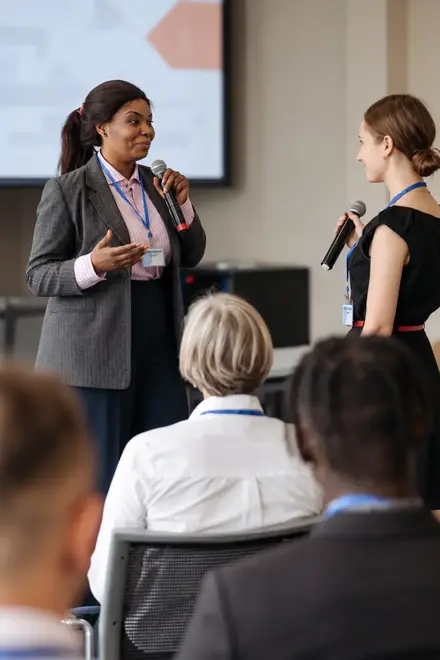 02_Growth_Strategy_Conversations.webp — Conference speakers having a discussion with an attentive audience. 02_Growth_Strategy_Conversations.webp — Conference speakers having a discussion with an attentive audience.