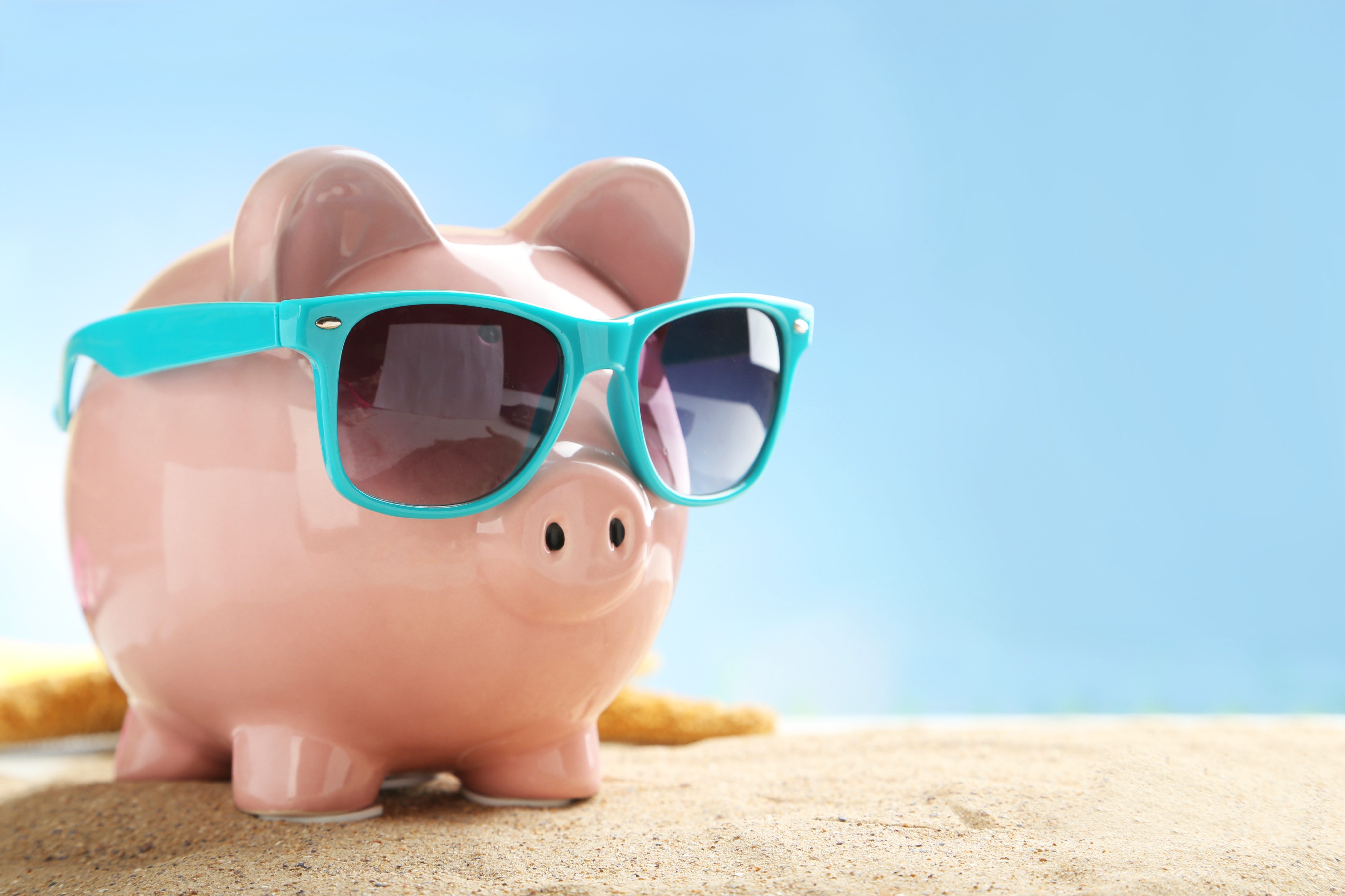 a piggybank in aquamarine glasses