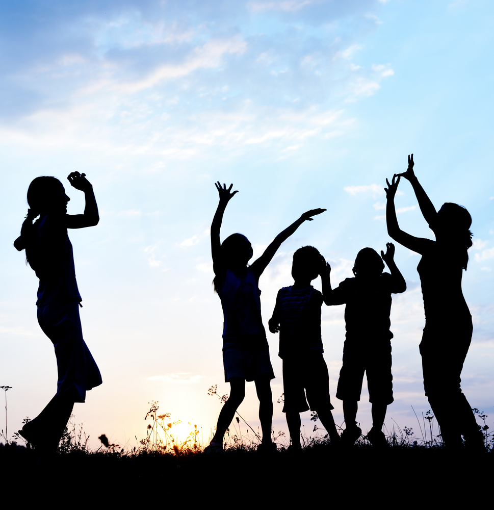 kids in silhouette dancing 