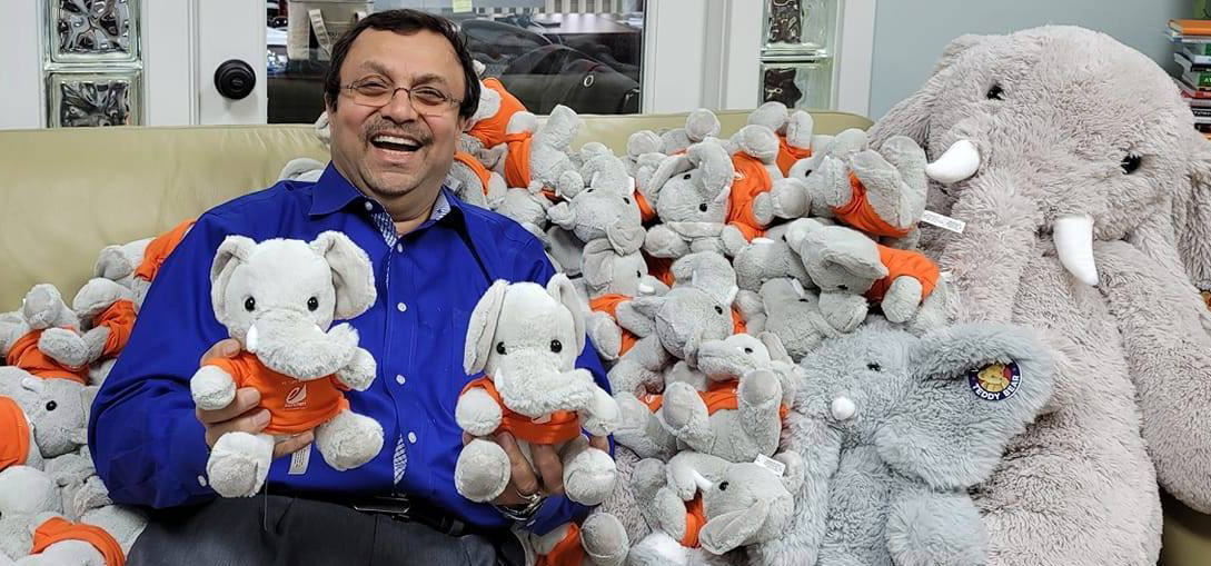 Author Parthiv Shah surrounded by BRENT mascots