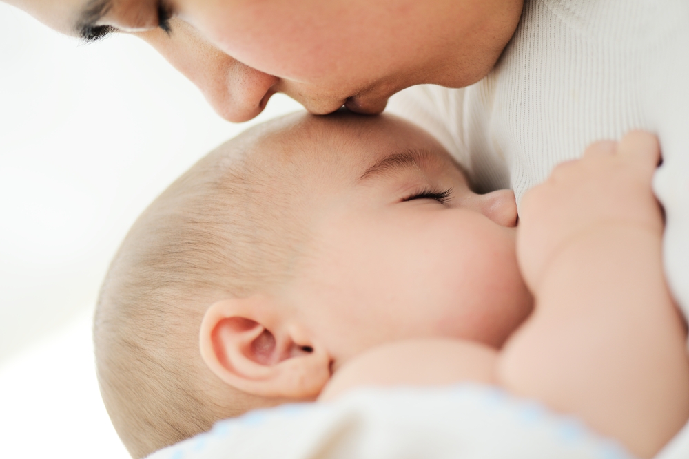 Mother being nurturing to baby