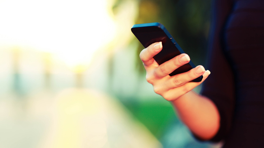 a hand holding a smartphone