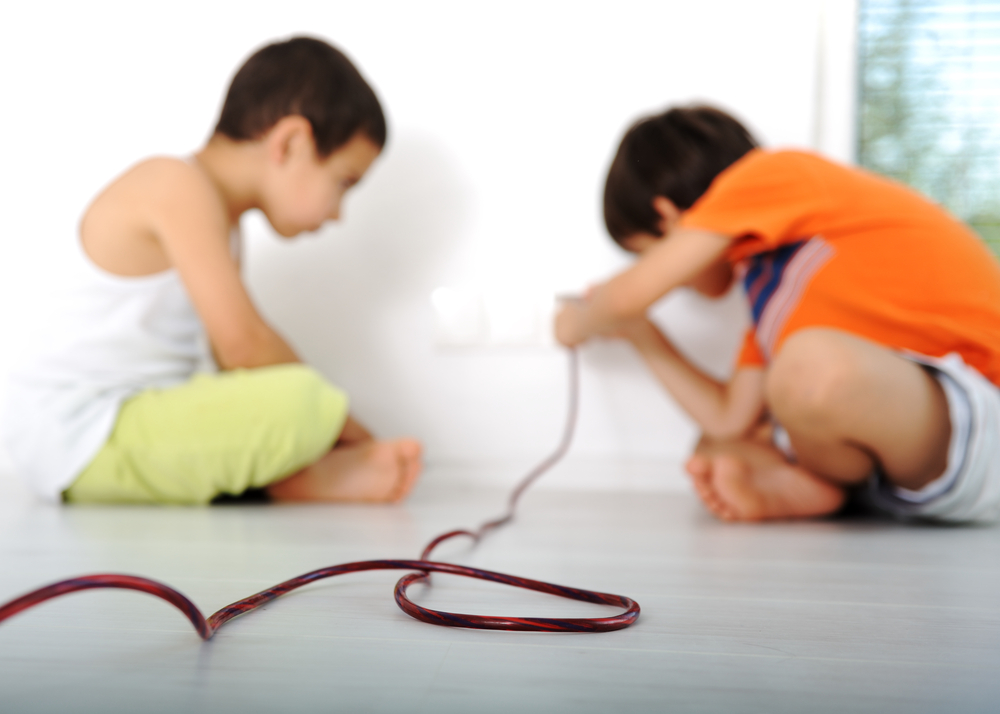 children plugging in a wire