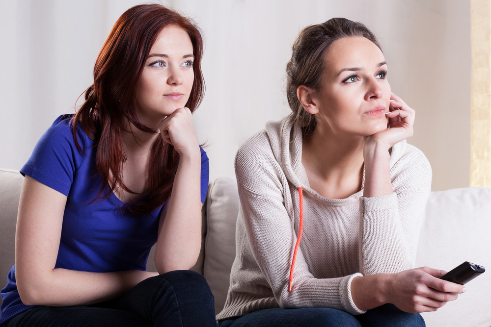 two women looking interested in something online