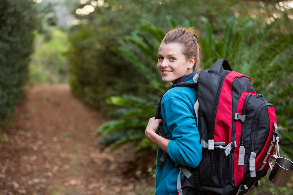 young woman hiking on a trail