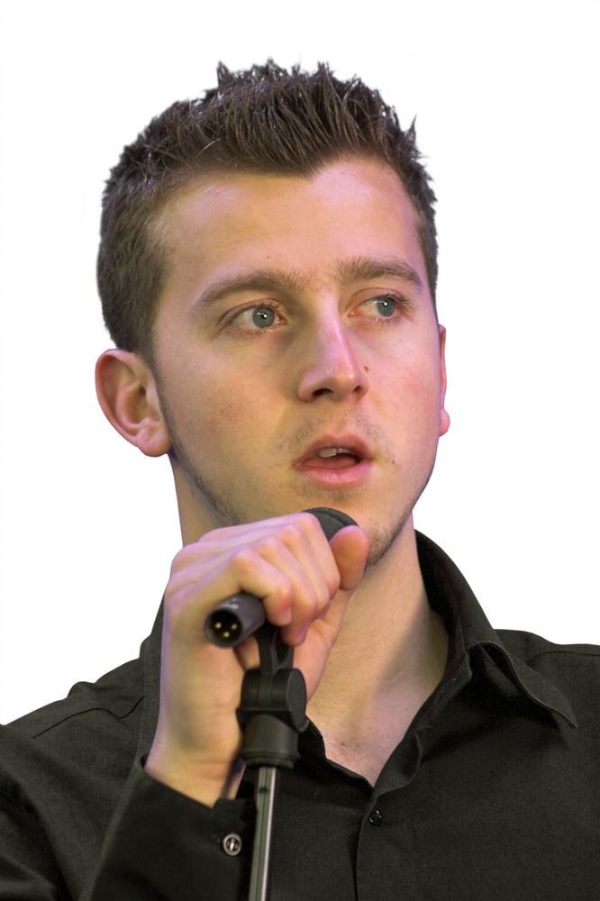 man speaking into a microphone