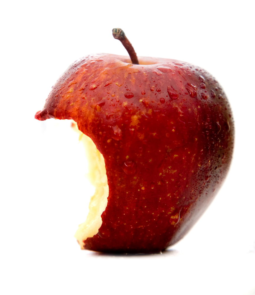 apple in red partially eaten isolated over a white background - talking about Apple