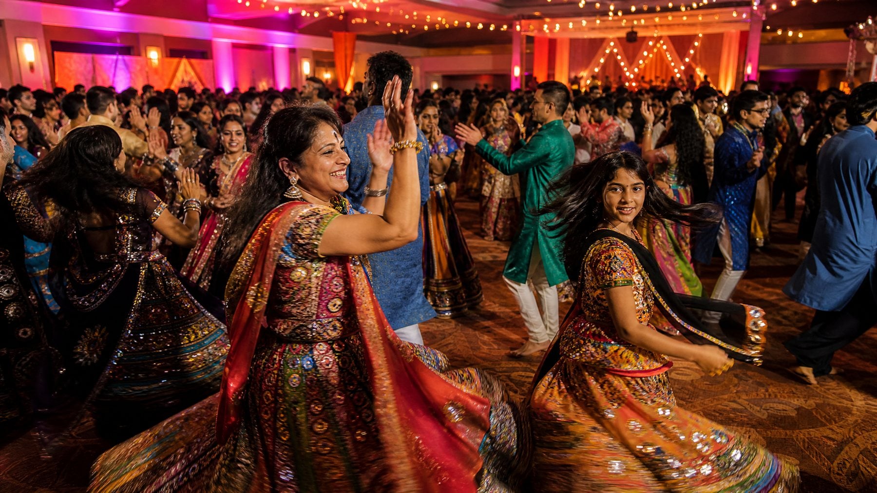 Hundreds of Indian American families dancing garba at a community celebration