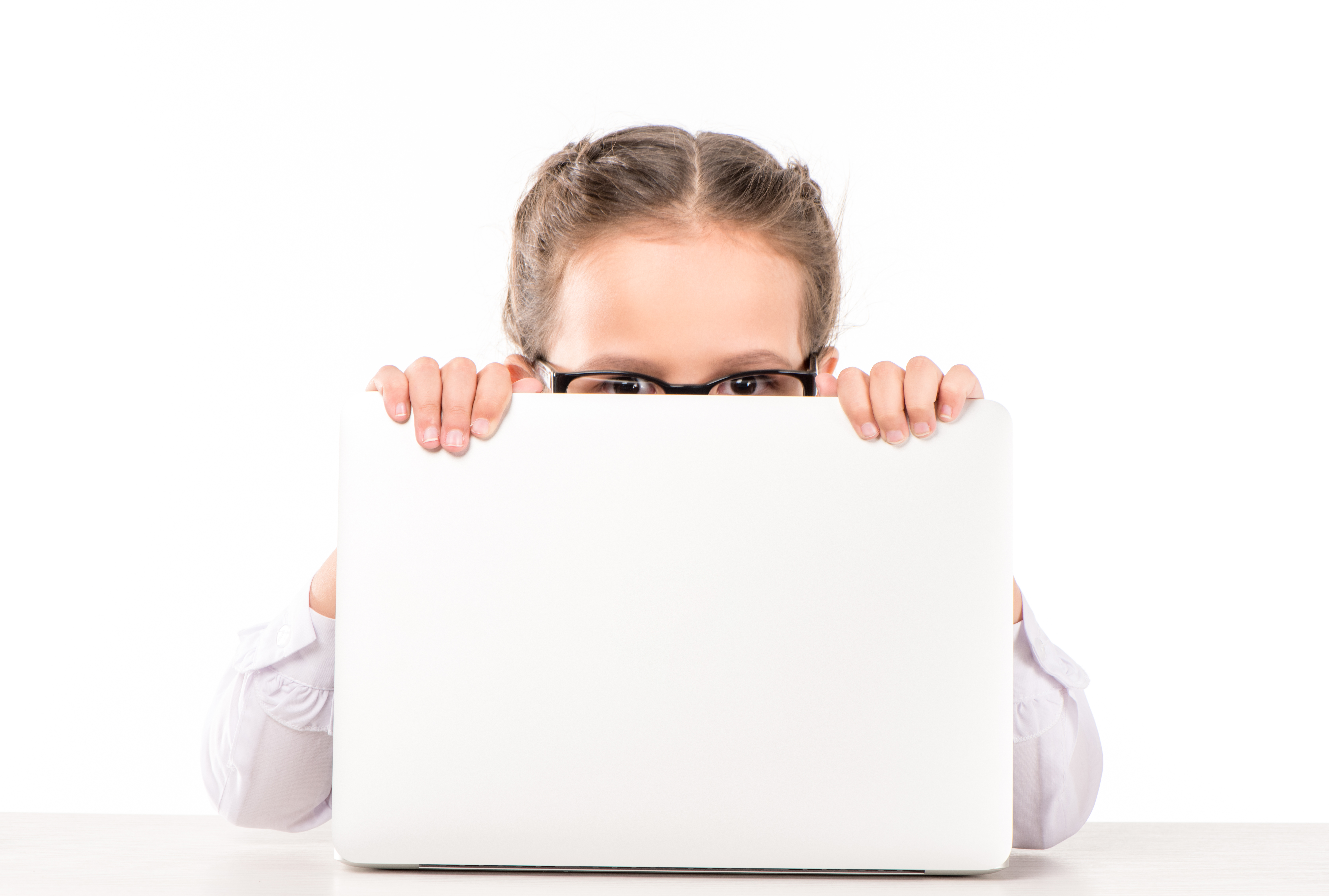 girl hiding behind laptop - looking for privacy